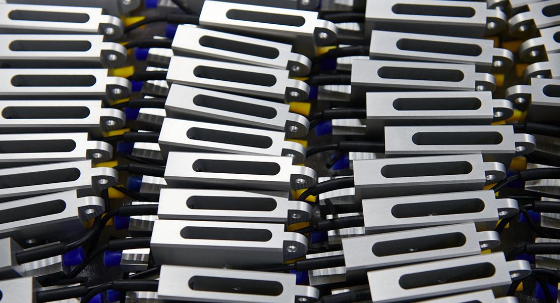 Metal pieces lined up in rows